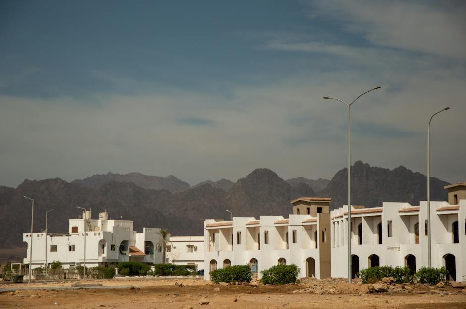 An image of a deserted ghost town with crumbling buildings, showcasing the eerie beauty and historical significance of these abandoned places.