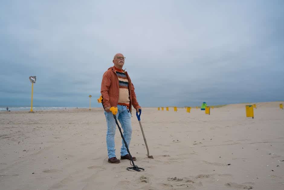 A picture of a treasure hunter wearing a hat, holding a metal detector, and standing in front of a scenic landscape.